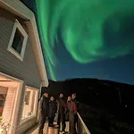 Discover The Ultimate Aurora Escape With A Cozy Outdoor Sauna And Hot Tub