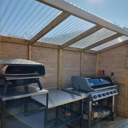 Discover The Ultimate Aurora Escape With A Cozy Outdoor Sauna And Hot Tub