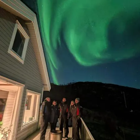 Discover The Ultimate Aurora Escape With A Cozy Outdoor Sauna And Hot Tub