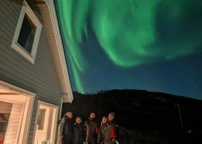 Discover The Ultimate Aurora Escape With A Cozy Outdoor Sauna And Hot Tub